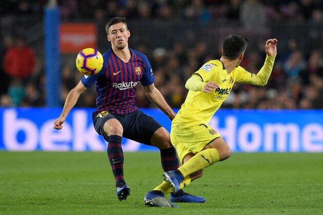 Barcelona's French defender Clement Lenglet (L) vies with Villarreal's Spanish forward Gerard Moreno during the Spanish league football match FC Barcelona against Villarreal CF at the Camp Nou stadium in Barcelona on December 2, 2018. (Photo by LLUIS GENE / AFP)        (Photo credit should read LLUIS GENE/AFP/Getty Images)
