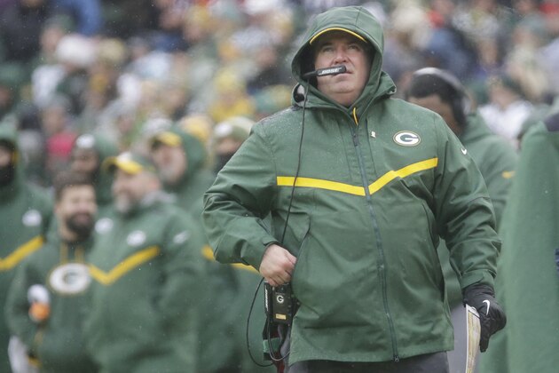 Green Bay Packers' Head Coach Mike McCarthy watches a replay on the scoreboard during the first half of an NFL football game against the Arizona Cardinals Sunday, Dec. 2, 2018, in Green Bay, Wis. (AP Photo/Mike Roemer)