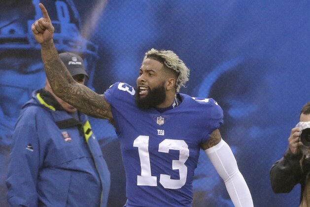 New York Giants wide receiver Odell Beckham reacts after throwing a touchdown pass to wide receiver Russell Shepard during the second half of an NFL football game against the Chicago Bears, Sunday, Dec. 2, 2018, in East Rutherford, N.J. (AP Photo/Seth Wenig)