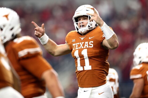 ARLINGTON, TEXAS - DECEMBER 01:  Sam Ehlinger #11 of the Texas Longhorns celebrates his touchdown run against the Oklahoma Sooners in the first quarter at AT&T Stadium on December 01, 2018 in Arlington, Texas. (Photo by Ronald Martinez/Getty Images)