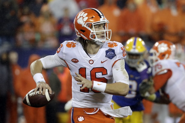 Clemson's Trevor Lawrence (16) looks to pass against Pittsburgh in the first half of the Atlantic Coast Conference championship NCAA college football game in Charlotte, N.C., Saturday, Dec. 1, 2018. (AP Photo/Chuck Burton)