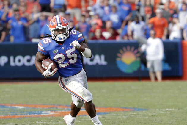 Florida running back Jordan Scarlett (25) runs against South Carolina during the second half of an NCAA college football game, Saturday, Nov. 10, 2018, in Gainesville, Fla. (AP Photo/John Raoux)
