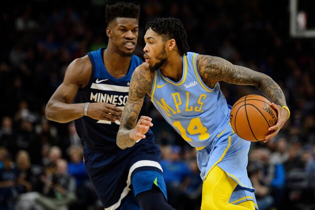 MINNEAPOLIS, MN - JANUARY 01: Brandon Ingram #14 of the Los Angeles Lakers drives to the basket against Jimmy Butler #23 of the Minnesota Timberwolves during the game on January 1, 2018 at the Target Center in Minneapolis, Minnesota. NOTE TO USER: User expressly acknowledges and agrees that, by downloading and or using this Photograph, user is consenting to the terms and conditions of the Getty Images License Agreement. (Photo by Hannah Foslien/Getty Images)