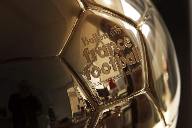 The Golden Ball is pictured in Boulogne-Billancourt, outside Paris, Friday, Sept. 21, 2018.  A woman will lift the most prestigious individual trophy in soccer for the first time this year. Awarded every year by France Football magazine since Stanley Matthews won it in 1956, the Ballon d'Or for the best player of the year will be given to both a woman and a man on Dec. 3 in Paris. (AP Photo/Christophe Ena)