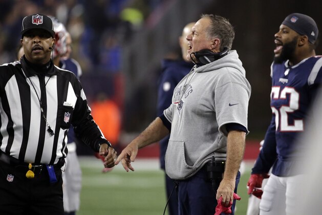 New England Patriots head coach Bill Belichick, center, appeals to side judge Adrian Hill, left, during the second half of an NFL football game against the Minnesota Vikings, Sunday, Dec. 2, 2018, in Foxborough, Mass. (AP Photo/Elise Amendola)