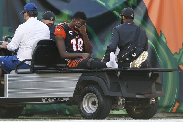 Cincinnati Bengals wide receiver A.J. Green is helped off the field after an apparent injury in the first half of an NFL football game against the Denver Broncos, Sunday, Dec. 2, 2018, in Cincinnati. (AP Photo/Gary Landers)