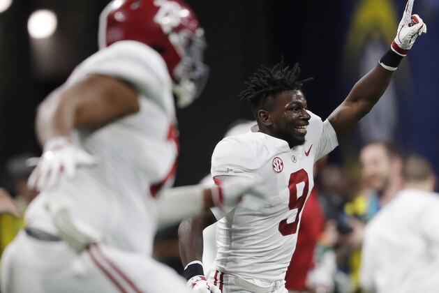 Alabama wide receiver Xavier Williams (9) celebrates with team mates after the Southeastern Conference championship NCAA college football game against Georgia, Saturday, Dec. 1, 2018, in Atlanta. Alabama won 35-28. (AP Photo/John Bazemore)