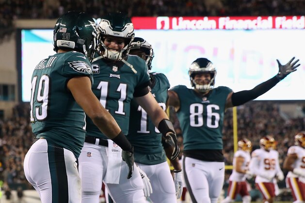 PHILADELPHIA, PA - DECEMBER 03:  Wide receiver Golden Tate #19 of the Philadelphia Eagles celebrates with teammates quarterback Carson Wentz #11 and tight end Zach Ertz #86  after scoring a touchdown against the Washington Redskins in the first quarter at Lincoln Financial Field on December 3, 2018 in Philadelphia, Pennsylvania.  (Photo by Elsa/Getty Images)