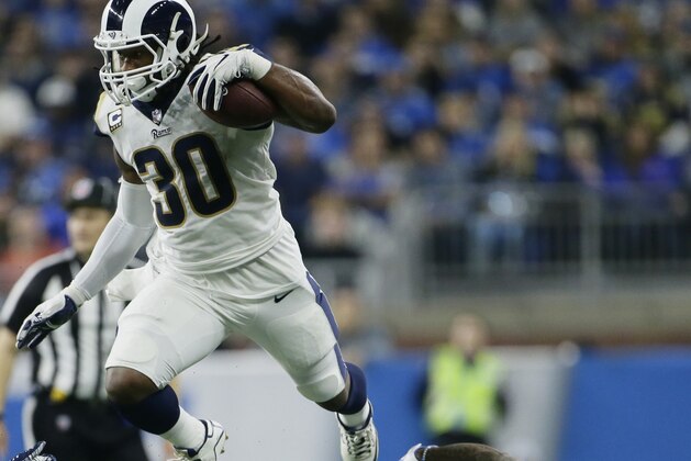 Los Angeles Rams running back Todd Gurley (30) jumps over Detroit Lions free safety Glover Quin (27) during the first half of an NFL football game, Sunday, Dec. 2, 2018, in Detroit. (AP Photo/Duane Burleson)