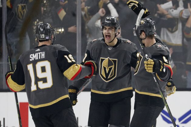 Vegas Golden Knights right wing Reilly Smith (19) and defenseman Colin Miller, right, celebrate after left wing Max Pacioretty, center, scored against the San Jose Sharks during the first period of an NHL hockey game Saturday, Nov. 24, 2018, in Las Vegas. (AP Photo/John Locher)