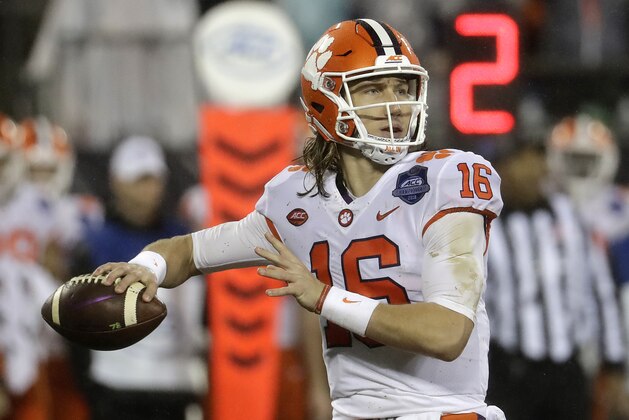 Clemson's Trevor Lawrence (16) looks to pass against Pittsburgh in the first half of the Atlantic Coast Conference championship NCAA college football game in Charlotte, N.C., Saturday, Dec. 1, 2018. (AP Photo/Chuck Burton)
