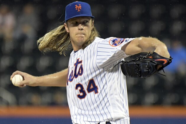 New York Mets pitcher Noah Syndergaard delivers the ball to an Atlanta Braves batter during the first inning of a baseball game Tuesday, Sept. 25, 2018, in New York. (AP Photo/Bill Kostroun)