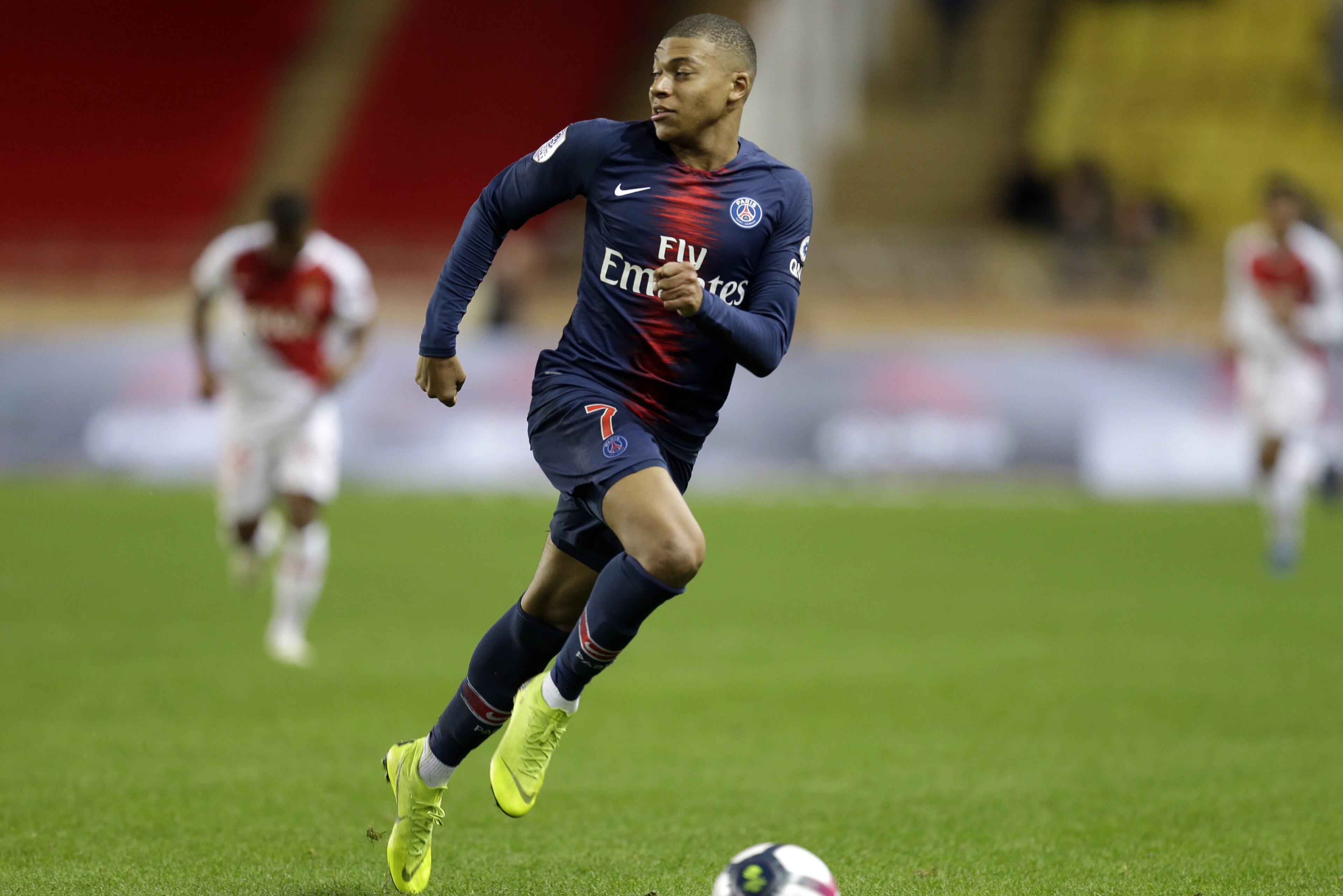 PSG's Kylian Mbappe runs with the ball during the French League One soccer match between AS Monaco and Paris Saint-Germain at Stade Louis II in Monaco, Sunday, Nov. 11, 2018 (AP Photo/Claude Paris)