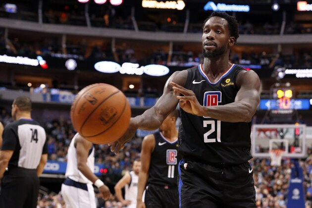 Los Angeles Clippers guard Patrick Beverley (21) throws a ball at a fan during the second half of an NBA basketball game against the Dallas Mavericks in Dallas, Sunday, Dec. 2, 2018. Dallas won 114-110. Beverley was ejected from the game. (AP Photo/Michael Ainsworth)
