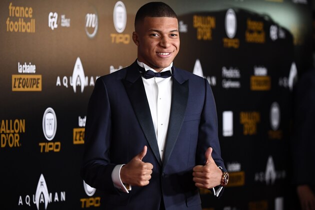 Paris Saint-Germain's French forward Kylian Mbappe poses upon arrival at the 2018 Ballon d'Or award ceremony at the Grand Palais in Paris on December 3, 2018. (Photo by FRANCK FIFE / AFP) (Photo credit should read FRANCK FIFE/AFP/Getty Images) Paris Saint-Germain's French forward Kylian Mbappe poses upon arrival at the 2018 Ballon d'Or award ceremony at the Grand Palais in Paris on December 3, 2018. (Photo by FRANCK FIFE / AFP) (Photo credit should read FRANCK FIFE/AFP/Getty Images)