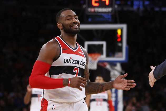 Washington Wizards' John Wall celebrates during the fourth quarter of an NBA basketball game against the New York Knicks Monday, Dec. 3, 2018, in New York. (AP Photo/Jason DeCrow)