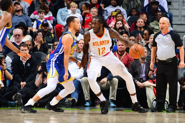 ATLANTA, GA - DECEMBER 3: Taurean Prince #12 of the Atlanta Hawks handles the ball during the game against Stephen Curry #30 of the Golden State Warriors on December 3, 2018 at State Farm Arena in Atlanta, Georgia.  NOTE TO USER: User expressly acknowledges and agrees that, by downloading and/or using this Photograph, user is consenting to the terms and conditions of the Getty Images License Agreement. Mandatory Copyright Notice: Copyright 2018 NBAE (Photo by Scott Cunningham/NBAE via Getty Images)