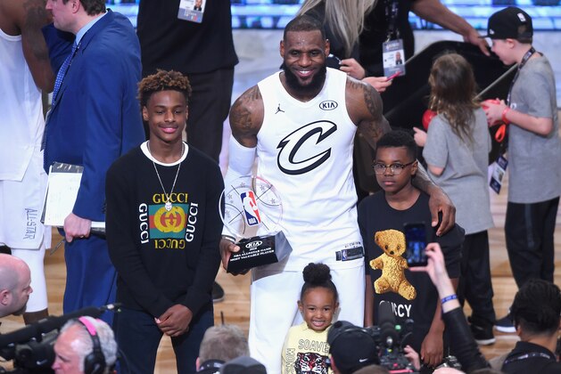 LOS ANGELES, CA - FEBRUARY 18:  (L-R) LeBron James Jr., LeBron James #23, Zhuri James and Bryce Maximus James pose for a photo with the All-Star Game MVP trophy during the NBA All-Star Game 2018 at Staples Center on February 18, 2018 in Los Angeles, California.  (Photo by Jayne Kamin-Oncea/Getty Images)