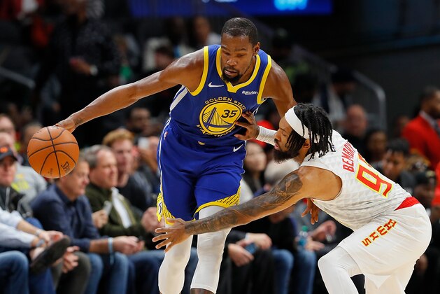 ATLANTA, GA - DECEMBER 03:  DeAndre' Bembry #95 of the Atlanta Hawks defends against Kevin Durant #35 of the Golden State Warriors at State Farm Arena on December 3, 2018 in Atlanta, Georgia.  NOTE TO USER: User expressly acknowledges and agrees that, by downloading and or using this photograph, User is consenting to the terms and conditions of the Getty Images License Agreement.  (Photo by Kevin C. Cox/Getty Images)