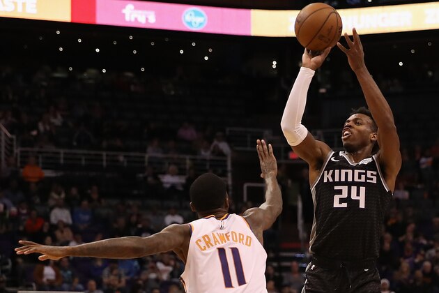PHOENIX, ARIZONA - DECEMBER 04: Buddy Hield #24 of the Sacramento Kings attempts a shot over Jamal Crawford #11 of the Phoenix Suns during the first half of the NBA game at Talking Stick Resort Arena on December 4, 2018 in Phoenix, Arizona.  NOTE TO USER: User expressly acknowledges and agrees that, by downloading and or using this photograph, User is consenting to the terms and conditions of the Getty Images License Agreement. (Photo by Christian Petersen/Getty Images)