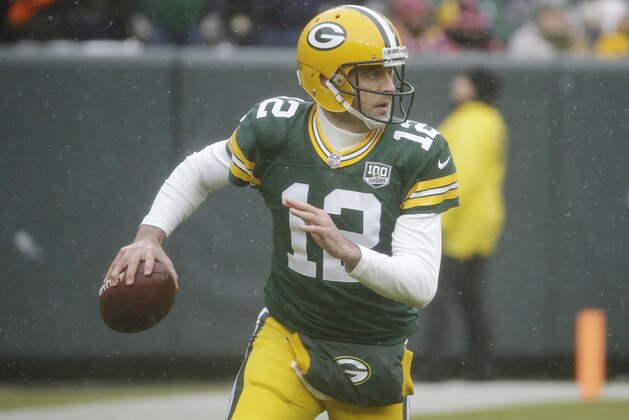 Green Bay Packers quarterback Aaron Rodgers looks to pass during the first half of an NFL football game against the Arizona Cardinals Sunday, Dec. 2, 2018, in Green Bay, Wis. (AP Photo/Mike Roemer)