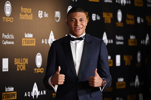 Paris Saint-Germain's French forward Kylian Mbappe poses upon arrival at the 2018  Ballon d'Or award ceremony at the Grand Palais in Paris on December 3, 2018. (Photo by FRANCK FIFE / AFP)        (Photo credit should read FRANCK FIFE/AFP/Getty Images)