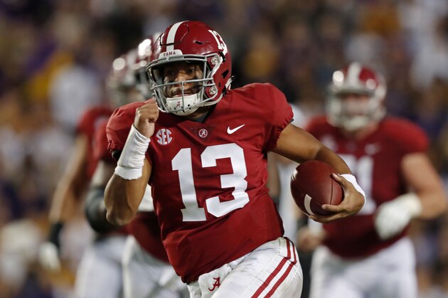 Alabama quarterback Tua Tagovailoa (13) rushes on a 44 yard touchdown carry in the second half of an NCAA college football game in Baton Rouge, La., Saturday, Nov. 3, 2018. Alabama won 29-0. (AP Photo/Gerald Herbert)