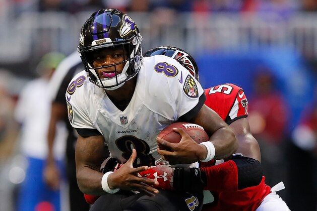 ATLANTA, GA - DECEMBER 02:  Lamar Jackson #8 of the Baltimore Ravens rushes against Foye Oluokun #54 of the Atlanta Falcons at Mercedes-Benz Stadium on December 2, 2018 in Atlanta, Georgia.  (Photo by Kevin C. Cox/Getty Images)