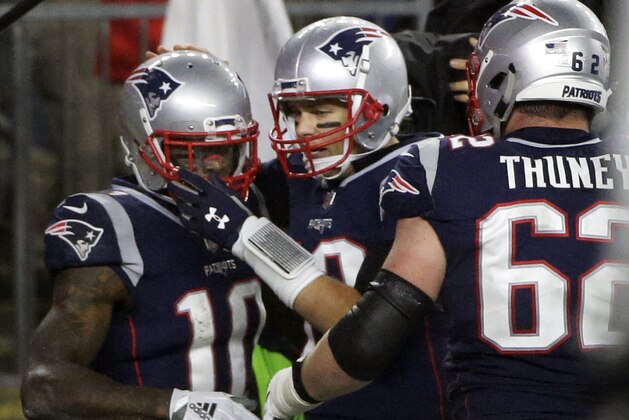 New England Patriots quarterback Tom Brady, center, celebrates his touchdown pass to Josh Gordon, left, during the second half of an NFL football game against the Minnesota Vikings, Sunday, Dec. 2, 2018, in Foxborough, Mass. It was Brady's 579th career touchdown pass, which tied him for the most passing touchdowns in NFL history. (AP Photo/Steven Senne)
