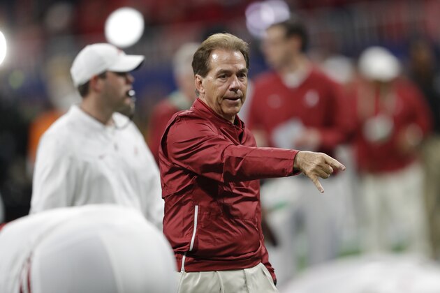 Alabama head coach Nick Saban speaks with players before the first half of the Southeastern Conference championship NCAA college football game against Georgia, Saturday, Dec. 1, 2018, in Atlanta. (AP Photo/John Bazemore)