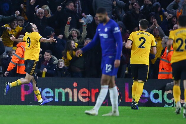 Wolverhampton Wanderers' Mexican striker Raul Jimenez (L) celebrates scoring their first goal to equalise 1-1 during the English Premier League football match between Wolverhampton Wanderers and Chelsea at the Molineux stadium in Wolverhampton, central England on December 5, 2018. (Photo by GEOFF CADDICK / AFP) / RESTRICTED TO EDITORIAL USE. No use with unauthorized audio, video, data, fixture lists, club/league logos or 'live' services. Online in-match use limited to 120 images. An additional 40 images may be used in extra time. No video emulation. Social media in-match use limited to 120 images. An additional 40 images may be used in extra time. No use in betting publications, games or single club/league/player publications. /         (Photo credit should read GEOFF CADDICK/AFP/Getty Images)