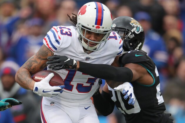BUFFALO, NY - NOVEMBER 25: Kelvin Benjamin #13 of the Buffalo Bills runs after catching a pass in the first quarter during NFL game action as Jalen Ramsey #20 of the Jacksonville Jaguars defends at New Era Field on November 25, 2018 in Buffalo, New York. (Photo by Tom Szczerbowski/Getty Images)
