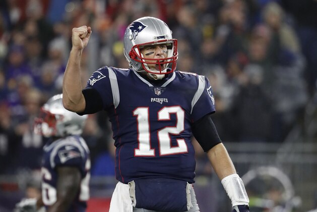 FILE - In this Sunday, Dec. 2, 2018, file photo, New England Patriots quarterback Tom Brady celebrates a touchdown during an NFL football game against the Minnesota Vikings at Gillette Stadium in Foxborough, Mass. Brady's next touchdown pass will move him past a couple of all-time greats. Brady is currently tied with Brett Favre for third place for the most regular-season TD passes with 508. Brady is also tied with Peyton Manning for the most ever combined in the regular season and playoffs with 579. (Winslow Townson/AP Images for Panini, FIle)