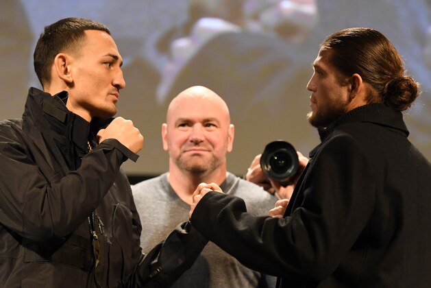 TORONTO, CANADA - DECEMBER 05:  (L-R) Opponents Max Holloway and Brian Ortega face off during the UFC 231 Press Conference at the Winter Garden Theatre on December 5, 2018 in Toronto, Ontario, Canada. (Photo by Josh Hedges/Zuffa LLC/Zuffa LLC via Getty Images)