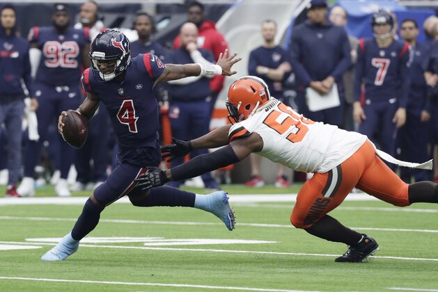 Houston Texans quarterback Deshaun Watson (4) is pressured by Cleveland Browns defensive end Chris Smith (50) during the first half of an NFL football game, Sunday, Dec. 2, 2018, in Houston. (AP Photo/Sam Craft)