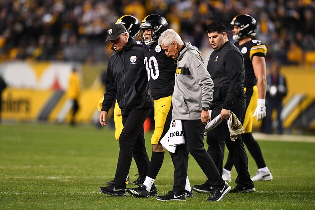 PITTSBURGH, PA - DECEMBER 02: James Conner #30 of the Pittsburgh Steelers walks off the field with trainers after an apparent injury in the fourth quarter during the game against the Los Angeles Chargers at Heinz Field on December 2, 2018 in Pittsburgh, Pennsylvania. (Photo by Joe Sargent/Getty Images)