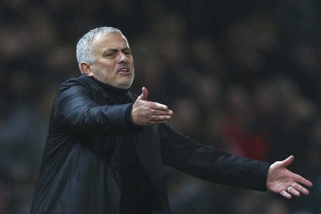 Manchester United's coach Jose Mourinho gives directions to his players during the English Premier League soccer match between Manchester United and Arsenal at Old Trafford stadium in Manchester, England, Wednesday Dec. 5, 2018. (AP Photo/Dave Thompson)