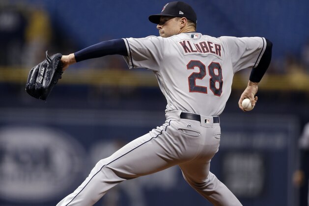 Cleveland Indians' Corey Kluber goes into his windup against the Tampa Bay Rays during the first inning of a baseball game Monday, Sept. 10, 2018, in St. Petersburg, Fla. (AP Photo/Chris O'Meara)