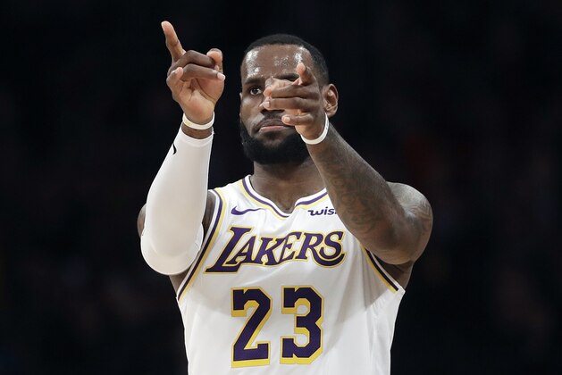 Los Angeles Lakers' LeBron James (23) gestures after scoring against the Phoenix Suns during the first half of an NBA basketball game Sunday, Dec. 2, 2018, in Los Angeles. (AP Photo/Marcio Jose Sanchez)