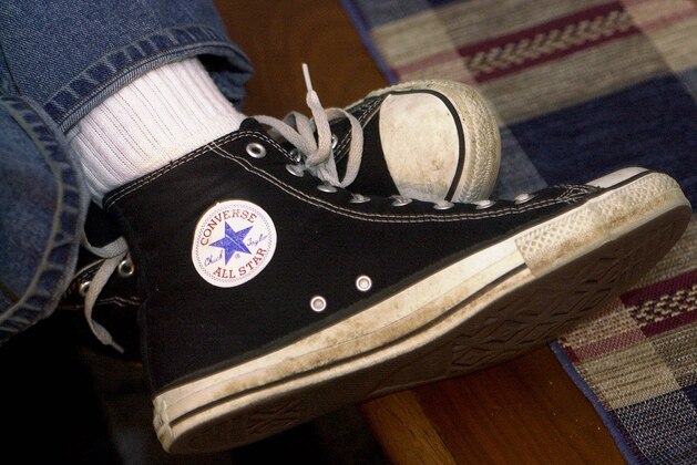 FILE - In this March 27, 2001 file photo, Mike Costantino displays his pair of Converse