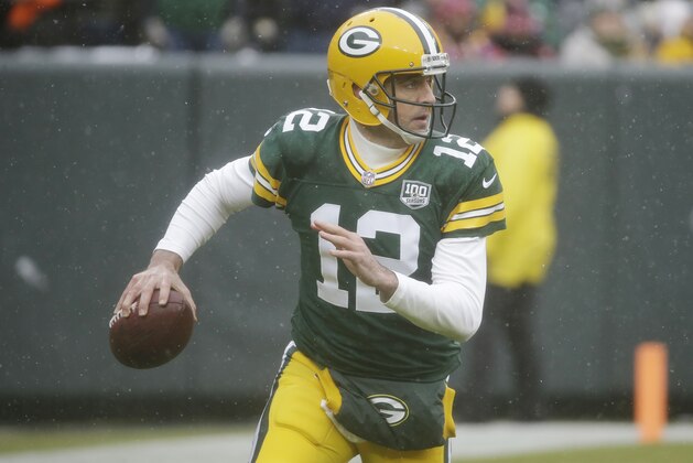 Green Bay Packers quarterback Aaron Rodgers looks to pass during the first half of an NFL football game against the Arizona Cardinals Sunday, Dec. 2, 2018, in Green Bay, Wis. (AP Photo/Mike Roemer)
