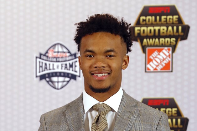 Oklahoma quarterback Kyler Murray poses with the trophy after winning The Davey O'Brien Award for being the top quarterback in college football, Thursday, Dec. 6, 2018, in Atlanta. (AP Photo/John Bazemore)