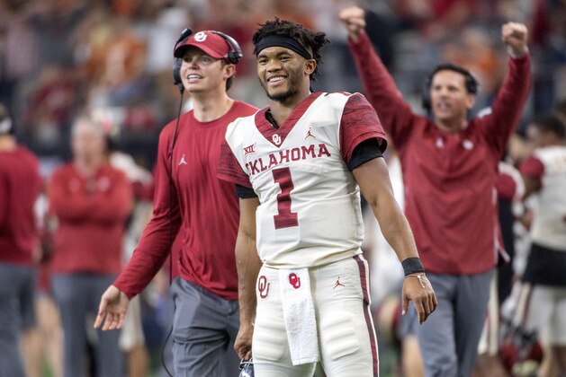 Oklahoma quarterback Kyler Murray (1) celebrates on the sidelines after throwing a touchdown against Oklahoma during the second half of the Big 12 Conference championship NCAA college football game on Saturday, Dec. 1, 2018, in Arlington, Texas. Oklahoma won 39-27. (AP Photo/Jeffrey McWhorter)