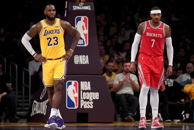 LOS ANGELES, CA - OCTOBER 20:  LeBron James #23 of the Los Angeles Lakers and Carmelo Anthony #7 of the Houston Rockets wait for and inbound at Staples Center on October 20, 2018 in Los Angeles, California.  (Photo by Harry How/Getty Images)