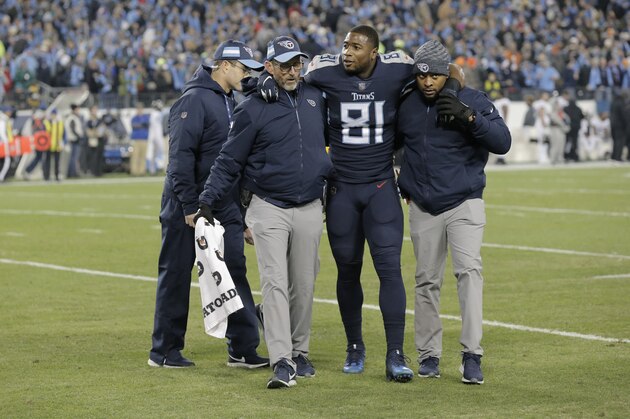 Tennessee Titans tight end Jonnu Smith (81) is helped on the turf after injury against the Jacksonville Jaguars during the first half of an NFL football game, Thursday, Dec. 6, 2018, in Nashville, Tenn. (AP Photo/James Kenney)