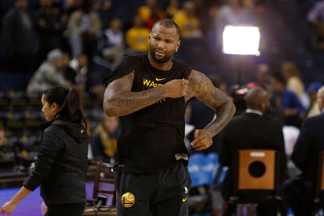 OAKLAND, CA - NOVEMBER 23: DeMarcus Cousins #0 of the Golden State Warriors cuts the sleeves of his warm up shirt before the game between the Golden State Warriors and the Portland Trail Blazers at ORACLE Arena on November 23, 2018 in Oakland, California. NOTE TO USER: User expressly acknowledges and agrees that, by downloading and or using this photograph, User is consenting to the terms and conditions of the Getty Images License Agreement. (Photo by Lachlan Cunningham/Getty Images)