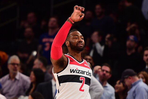 NEW YORK, NEW YORK - DECEMBER 03: John Wall #2 of the Washington Wizards reacts after scoring a basket in the final seconds of the fourth quarter of the game against New York Knicks at Madison Square Garden on December 03, 2018 in New York City. NOTE TO USER: User expressly acknowledges and agrees that, by downloading and or using this photograph, User is consenting to the terms and conditions of the Getty Images License Agreement. (Photo by Sarah Stier/Getty Images)