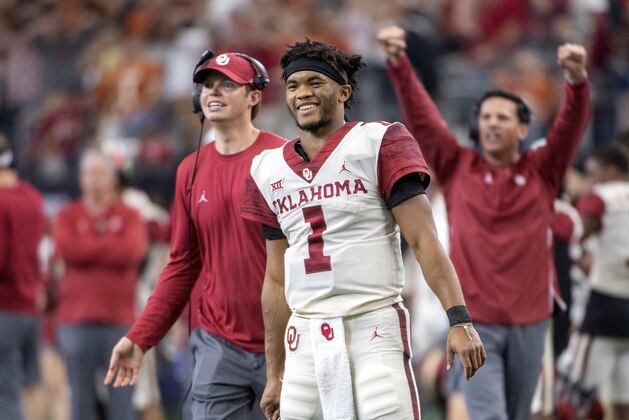 FILE - In this Dec. 1, 2018, file photo, Oklahoma quarterback Kyler Murray (1) celebrates on the sidelines after throwing a touchdown against Oklahoma during the second half of the Big 12 Conference championship NCAA college football game, in Arlington, Texas. Murray was named The Associated Press college football Player of the Year, Thursday, Dec. 6, 2018. (AP Photo/Jeffrey McWhorter, File)