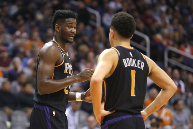 Phoenix Suns center Deandre Ayton (22) and Devin Booker (1) in the first half during an NBA basketball game against the Oklahoma City Thunder, Saturday, Nov. 17, 2018, in Phoenix. (AP Photo/Rick Scuteri)