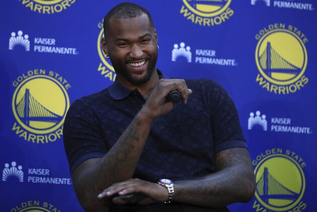 Golden State Warriors' DeMarcus Cousins laughs during a media conference Thursday, July 19, 2018, in Oakland, Calif. Cousins signed a one-year, $5.3M deal with the defending champion Warriors. (AP Photo/Ben Margot)
